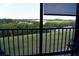 Scenic screened balcony view overlooking lush greenery and a tranquil waterway at 3200 Cove Cay Dr # 5F, Clearwater, FL 33760