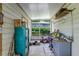 Enclosed back porch offering a versatile space with storage and natural light at 3317 15Th N St, St Petersburg, FL 33704