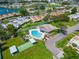 Overhead shot showcases the neighborhood's pool, shuffleboard, landscaping, and community vibe at 4326 Fern Glen St, Holiday, FL 34691