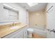 Neat bathroom featuring tub-shower combo, granite vanity, and functional toilet at 4326 Fern Glen St, Holiday, FL 34691