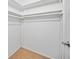 Organized closet with ample hanging space and storage shelving for efficient storage at 4326 Fern Glen St, Holiday, FL 34691