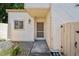 Close-up of the home's entryway, featuring a charming front porch at 4326 Fern Glen St, Holiday, FL 34691