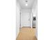 Hallway features tile flooring, an exterior door, and access to kitchen and other rooms at 4326 Fern Glen St, Holiday, FL 34691