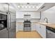 Updated kitchen featuring stainless steel appliances, butcher block counters and white cabinetry at 4326 Fern Glen St, Holiday, FL 34691