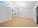 Bright living room with clerestory windows, tile floors, and open floor plan at 4326 Fern Glen St, Holiday, FL 34691