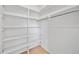 Walk-in closet features shelving and a clothing rod at 4326 Fern Glen St, Holiday, FL 34691