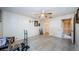 Bedroom featuring wood-look floors, ceiling fan, and doorway to the walk-in closet at 5265 E Bay Dr # 521, Clearwater, FL 33764