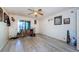 Bright bedroom with wood-look floors, ceiling fan, and a sliding door at 5265 E Bay Dr # 521, Clearwater, FL 33764