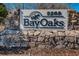 Well-maintained entrance sign to BayOaks community showcasing the address and stone detailing at 5265 E Bay Dr # 521, Clearwater, FL 33764