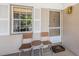 Welcoming outdoor seating area with a table and two chairs, perfect for enjoying the weather at 5265 E Bay Dr # 521, Clearwater, FL 33764