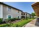 Attractive two-story building with well-maintained landscaping, shutters, and lush green lawn at 5265 E Bay Dr # 521, Clearwater, FL 33764