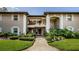 Charming condo featuring a well-maintained exterior with a front yard with lush landscaping at 5265 E Bay Dr # 521, Clearwater, FL 33764