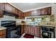 Well-equipped kitchen featuring ample storage and all black appliances at 5265 E Bay Dr # 521, Clearwater, FL 33764