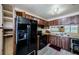 Spacious kitchen with ample cabinet space and modern black appliances at 5265 E Bay Dr # 521, Clearwater, FL 33764