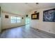 A spacious living room with vaulted ceiling, plank flooring, and lots of natural light at 5265 E Bay Dr # 521, Clearwater, FL 33764