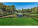 Picturesque pond with a central fountain, set within a lush green landscape, adding a peaceful ambiance to the community at 5265 E Bay Dr # 521, Clearwater, FL 33764
