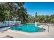 Community pool area with a clear blue pool, lounge chairs, and well-maintained surroundings for resident relaxation at 5265 E Bay Dr # 521, Clearwater, FL 33764