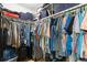 Walk-in closet featuring ample storage space and organization, with clothing racks and shelving at 7022 Kingsway Dr, Port Richey, FL 34668