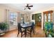 Cozy dining room featuring hardwood floors and natural light from the window at 7022 Kingsway Dr, Port Richey, FL 34668