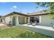 Charming single-story home featuring a front porch, with an ornamental iron gate and shuttered windows at 7022 Kingsway Dr, Port Richey, FL 34668