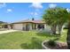 Charming single-story home featuring a lush front lawn and a cozy front porch area at 7022 Kingsway Dr, Port Richey, FL 34668