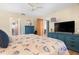 Comfortable bedroom with a beach-themed decor, wood-look flooring, and a calming atmosphere at 7022 Kingsway Dr, Port Richey, FL 34668