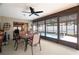 Covered patio featuring a dining set and view of the pool at 7022 Kingsway Dr, Port Richey, FL 34668