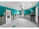 Bright bedroom featuring aqua walls, white ceiling, and evidence of remodeling needed at 814 Florida Ave, Palm Harbor, FL 34683