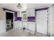 Kitchen with white cabinets, an open layout, and in need of renovation to create a perfect culinary space at 814 Florida Ave, Palm Harbor, FL 34683