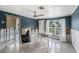 Bright living room with tile flooring and a large window offering natural light, undergoing renovation at 814 Florida Ave, Palm Harbor, FL 34683