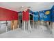 View of a room showing custom artwork, and showing the remodel that is needed at 814 Florida Ave, Palm Harbor, FL 34683