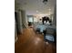 Open concept living space with hardwood floors and staircase at 8405 Costa Bella Way, Temple Terrace, FL 33637