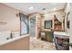 Bright bathroom with a glass-enclosed shower, vanity, and shelving with stylish sunflowers for decor at 855 Pinewood W Ter, Palm Harbor, FL 34683