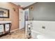Functional bathroom featuring a tub, toilet, sink, and decor details, maximizing space and style at 855 Pinewood W Ter, Palm Harbor, FL 34683