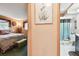 Inviting bedroom and adjacent bathroom offer a glimpse of comfort and convenience at 855 Pinewood W Ter, Palm Harbor, FL 34683