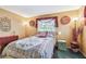 Charming bedroom bathed in natural light, showcasing unique wall decorations and tasteful furnishings at 855 Pinewood W Ter, Palm Harbor, FL 34683