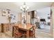 Open dining area flowing into the living room, showcasing natural light and neutral tones at 855 Pinewood W Ter, Palm Harbor, FL 34683