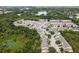 Gorgeous aerial view of a neighborhood surrounded by lush green trees and foliage in a serene setting at 9630 Carlsdale Dr, Riverview, FL 33578