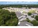 Stunning aerial view of a residential community nestled within lush green surroundings and a serene atmosphere at 9630 Carlsdale Dr, Riverview, FL 33578
