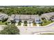 A high-angle view showcasing identical townhomes in a beautiful, well-maintained neighborhood at 9630 Carlsdale Dr, Riverview, FL 33578