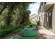 The backyard is secluded with trees and low maintenance ground cover at 9630 Carlsdale Dr, Riverview, FL 33578