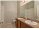 This bathroom features a double sink vanity and tile flooring at 9630 Carlsdale Dr, Riverview, FL 33578