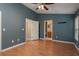 Spacious bedroom has laminate floors, with attached bathroom and closet at 9630 Carlsdale Dr, Riverview, FL 33578