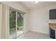 Cozy dining space featuring tiled floors, a sliding door that leads to the backyard, and natural lighting at 9630 Carlsdale Dr, Riverview, FL 33578