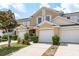 Townhome featuring well-kept landscaping, attached garages and manicured lawn at 9630 Carlsdale Dr, Riverview, FL 33578