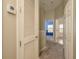Upstairs hallway with neutral walls, carpet, access to bedrooms, bathrooms, and a thermostat at 9630 Carlsdale Dr, Riverview, FL 33578
