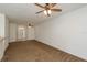 Inviting living room boasting cozy carpet, ceiling fans, an abundance of natural light, and an open design at 9630 Carlsdale Dr, Riverview, FL 33578