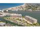 Stunning aerial view of the community with water views and boat docks at 1 Key Capri # 302E, Treasure Island, FL 33706