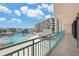 Relax on the balcony with stunning views of the pool and surrounding area at 1 Key Capri # 302E, Treasure Island, FL 33706