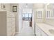 Hallway with vanity and closet leading to the living area with waterfront views at 1 Key Capri # 302E, Treasure Island, FL 33706